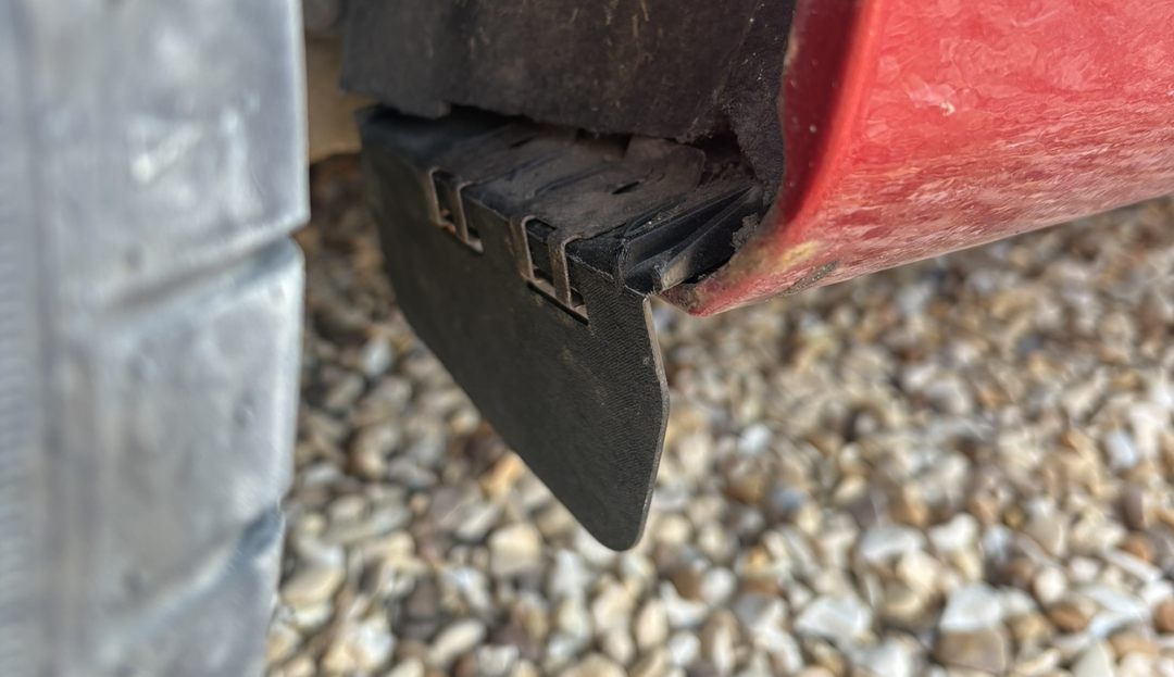 The reverse engineered deflector fitted under the rear arch, printed in black ASA