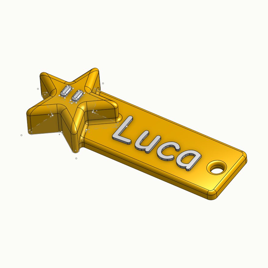 The name tag keyring modelled in Onshape with raised lettering and a star charm